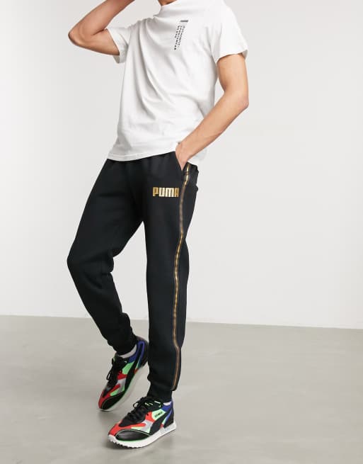 Black and 2025 gold puma joggers