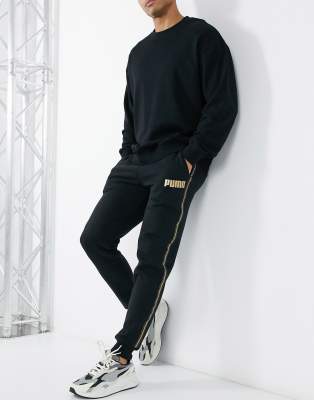 puma tracksuit black and gold