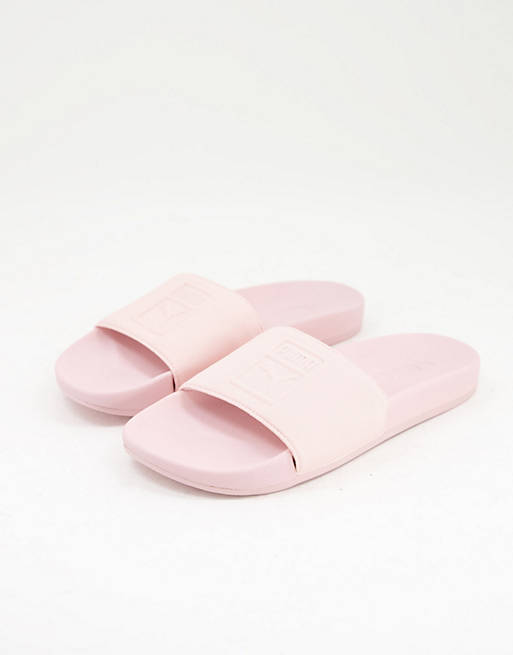 Puma Leadcat sliders with embossed logo in pink | ASOS