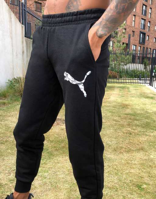 Puma logo shop joggers in black