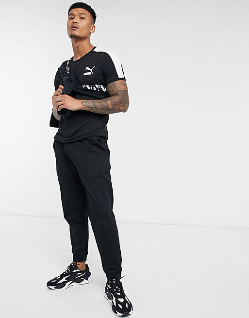 Puma logo t-shirt with sleeve detail in black | ASOS