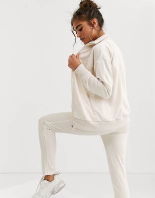 beige puma tracksuit