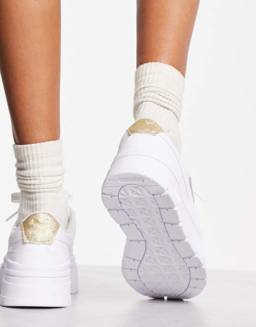 Puma blanche store et doree