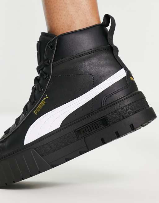 Black and gold store high top pumas