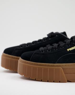 black trainers brown sole