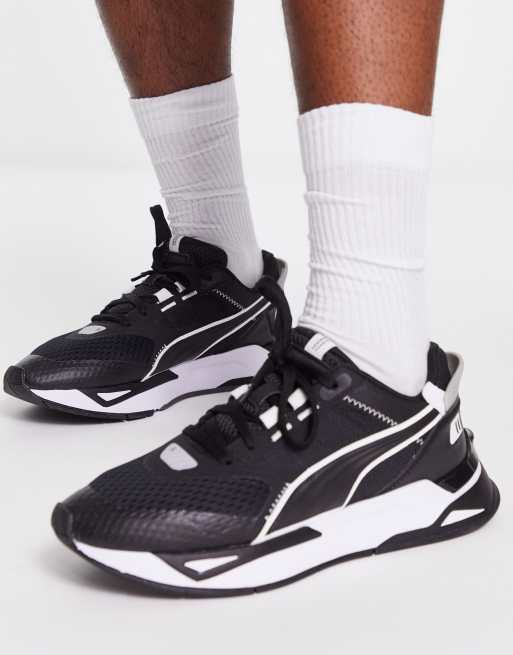 Puma black and store white trainers