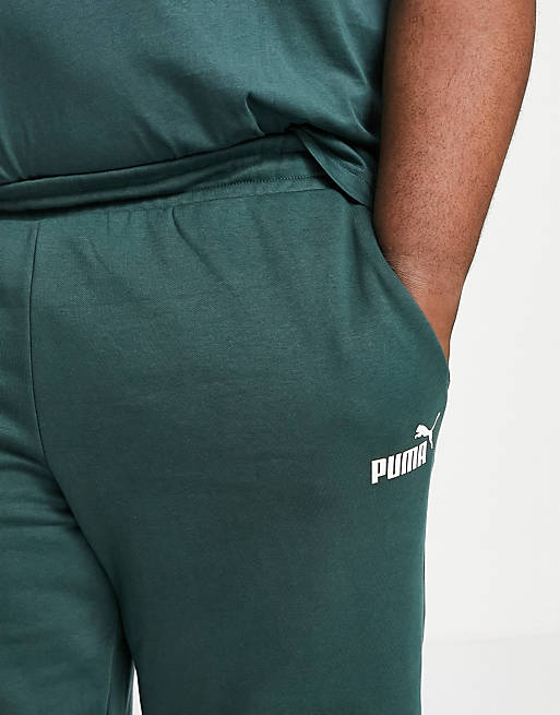 Men Puma Plus Essentials joggers in dark green 