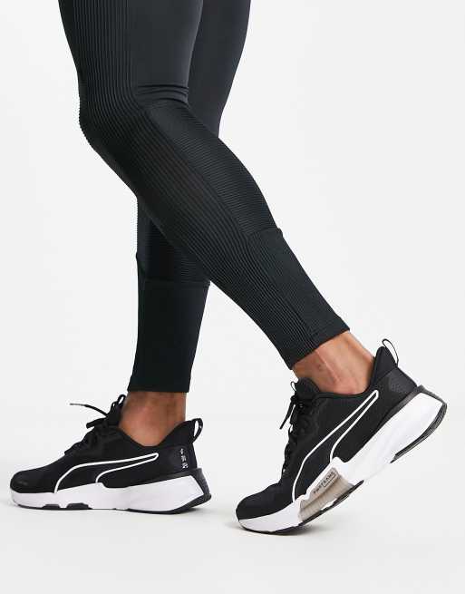 PUMA PowerFrame TR sneakers in black and white