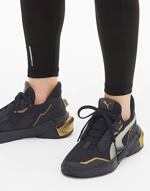 Puma Provoke XT sneakers in black and gold