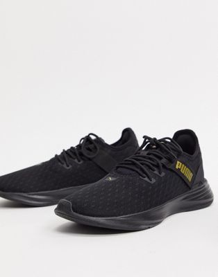 Puma Radiate XT trainers in black and gold