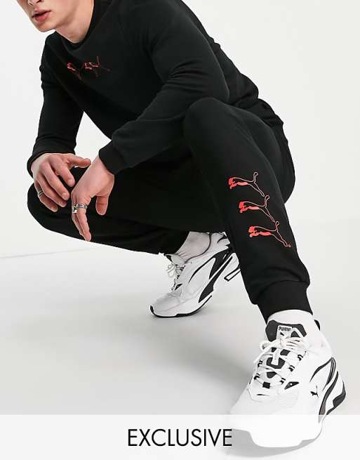 PUMA repeat cat logo trackies in black - exclusive to ASOS | ASOS