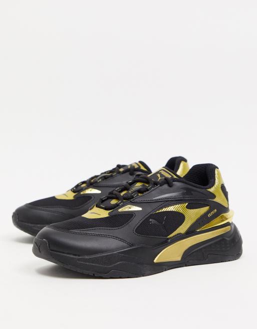 Black and gold store pumas