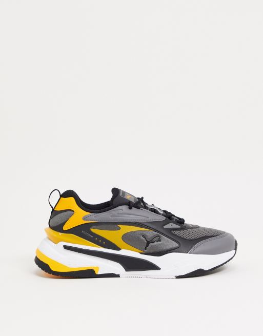 Puma black hotsell yellow trainers