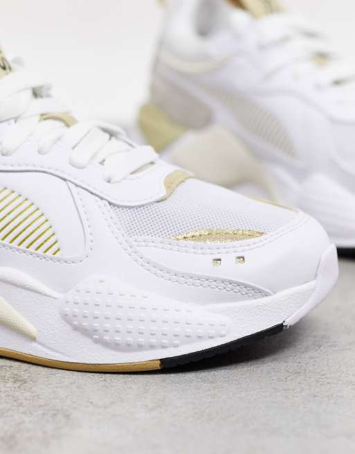 Puma RS X3 trainers in white and gold