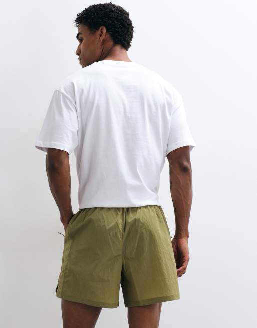 Puma Run culture collective t7 relaxed 5'' woven shorts in brown, 5 of 5