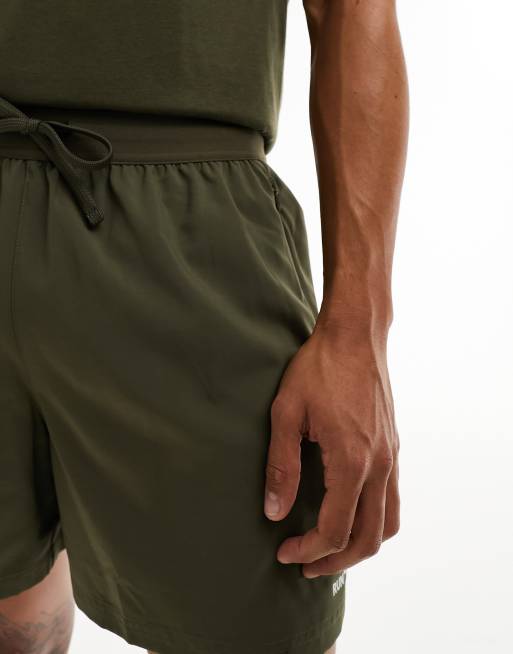 New Balance Printed Impact Run 5 Inch shorts in khaki