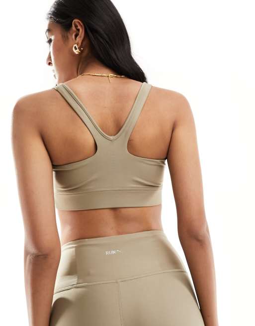 Puma Running Evolve medium support sports bra in brown | ASOS