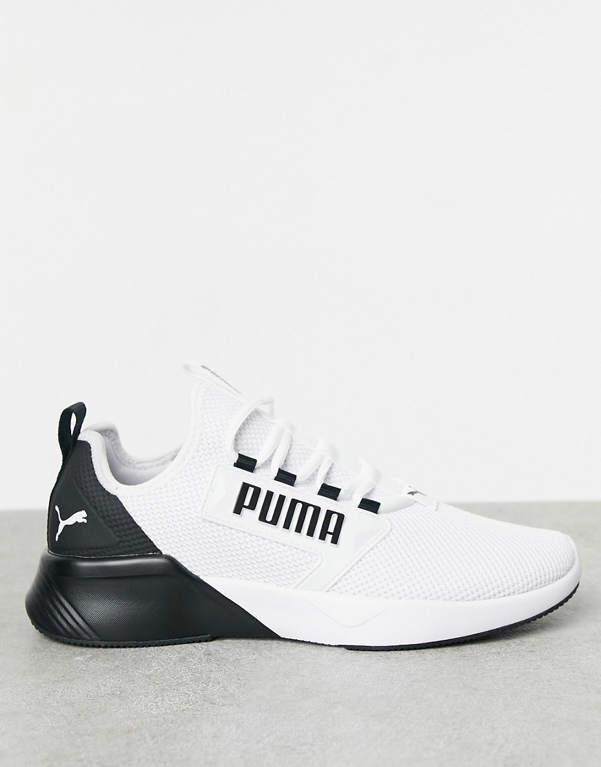 PUMA Running Retaliate sneakers in white and black