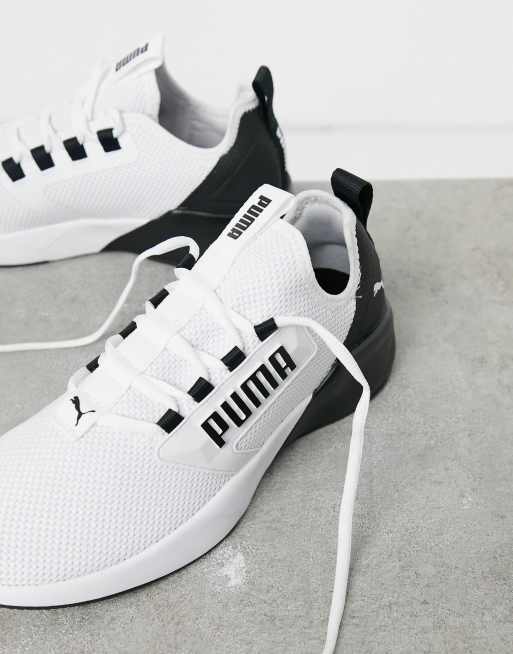 Puma Running Retaliate trainers in white and black