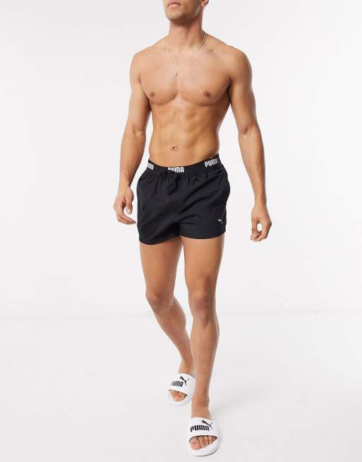 Puma short length logo waist band swim shorts in black | ASOS