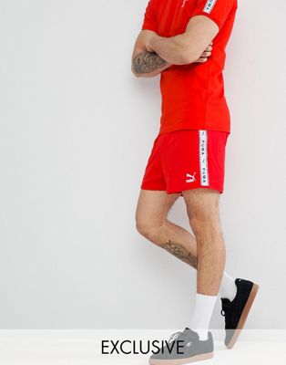 Puma shorts with taped side stripe in 