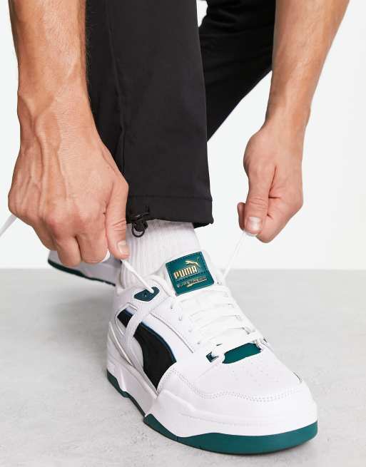 Puma slipstream trainers in white with black and green suede detail