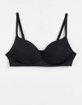 Puma soft padded t-shirt bra in black - ASOS Price Checker