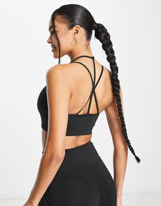 Puma Studio Granola light support strappy sports bra in black