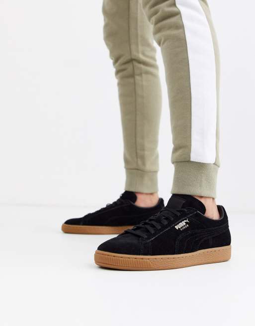 Puma suede trainers in store black with gum sole