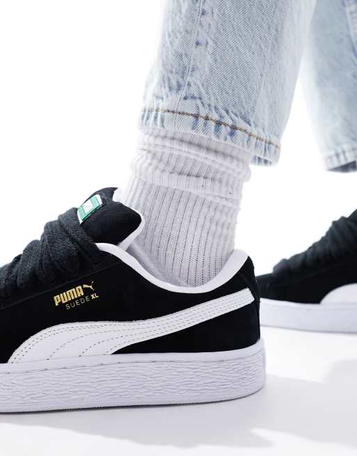 Puma suede cheap noir et or