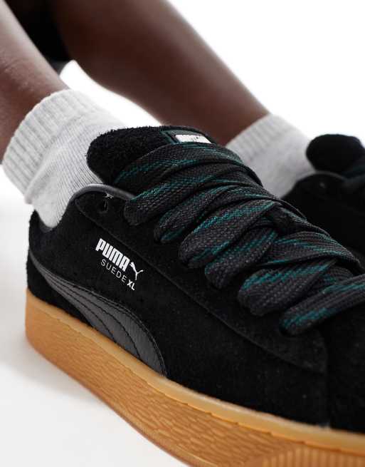 PUMA Suede XL sneakers in black with gum sole