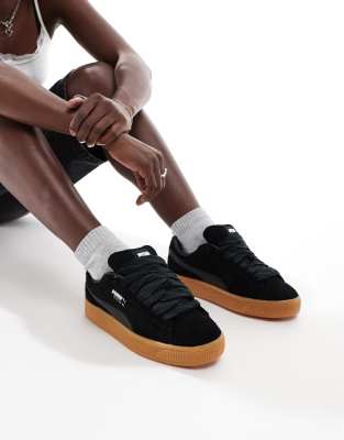 Puma Suede XL trainers in black with gum sole