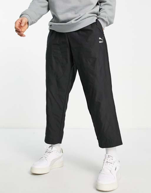 Puma – Svarta, quiltade, avsmalnande byxor med logga