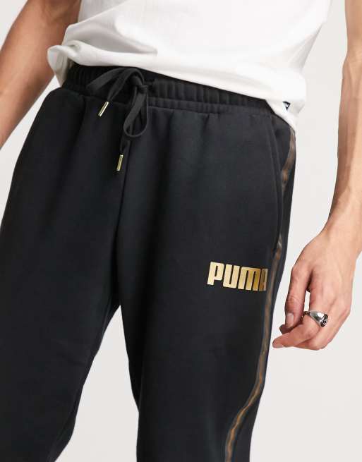 Black and gold pumas pants sale