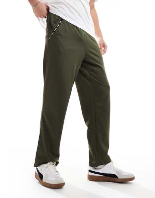 asos Puma Taped PWRFleece Lite joggers in olive