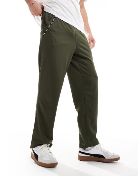 Puma Taped PWRFleece Lite joggers in olive - view 1