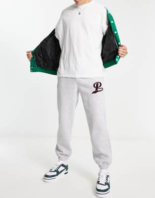 t-shirt, blonde hair, sweatpants, grey, puma sneakers, puma, puma