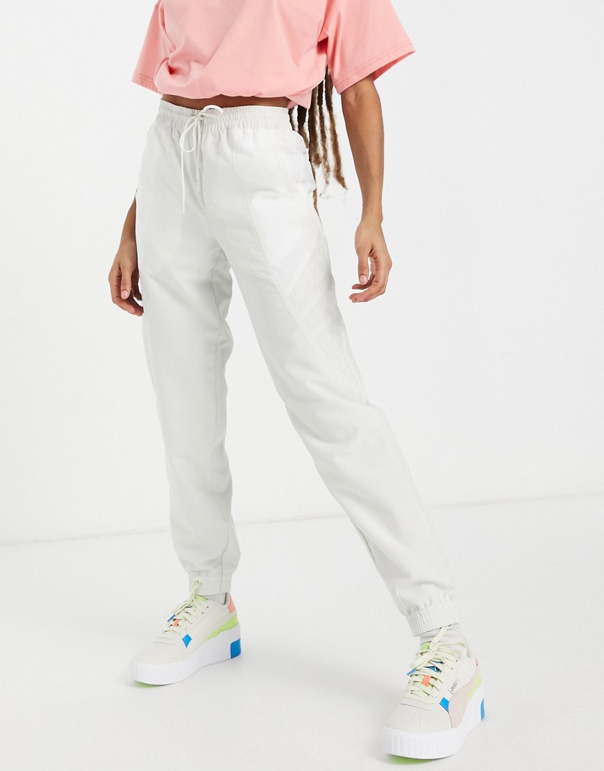 Puma TFS track pants with white leopard print colorblock