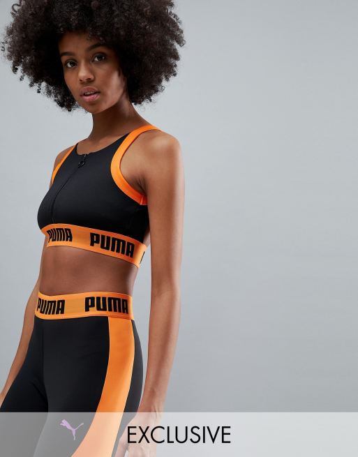 Puma - Top a reggiseno nero e arancione con zip - In esclusiva per ASOS
