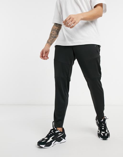 Puma train tapered knit pant trousers in black | ASOS