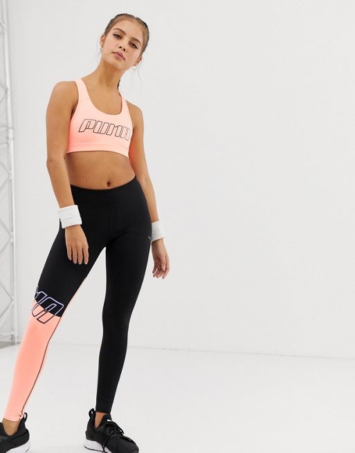Puma Training sports bra in pink with red straps exclusive to ASOS
