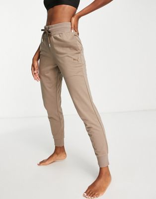 Puma Training Desert high waisted joggers in brown | ASOS