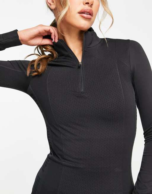 Puma Training Evoknit seamless 1/4 zip top in black