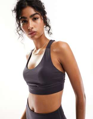 Puma Training Evolve medium support sports bra in dark grey - ASOS Price Checker