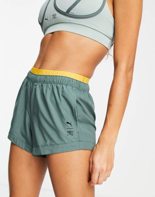 Puma Training First Mile woven shorts in green