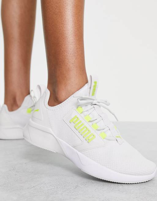 PUMA Training Retaliate Sneakers grigie con dettaglio giallo