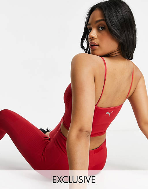 Puma Training seamless light support sports bra in red exclusive to ASOS