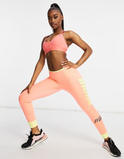Puma Training sports bra in pink with red straps exclusive to ASOS