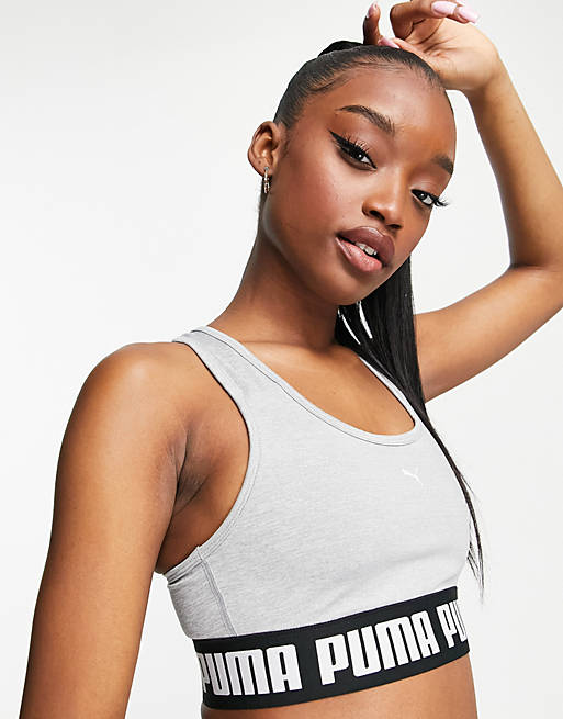 PUMA Training Strong mid support sports bra in gray | ASOS