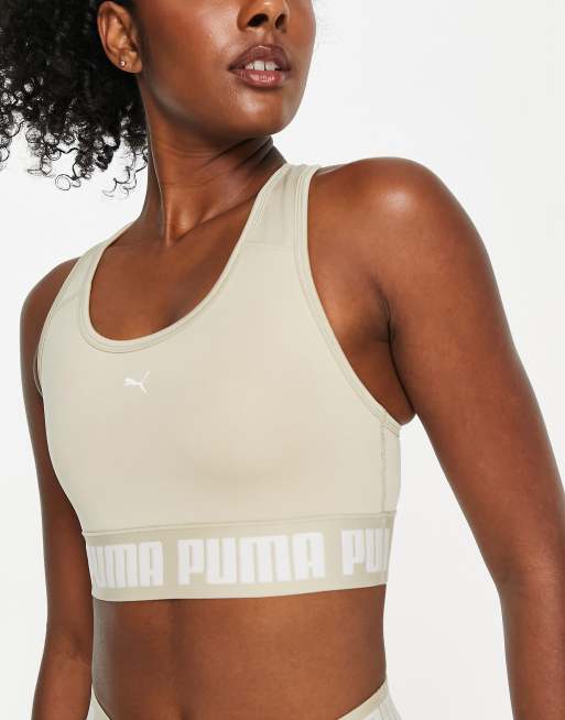 Puma Training Strong mid support sports bra in stone